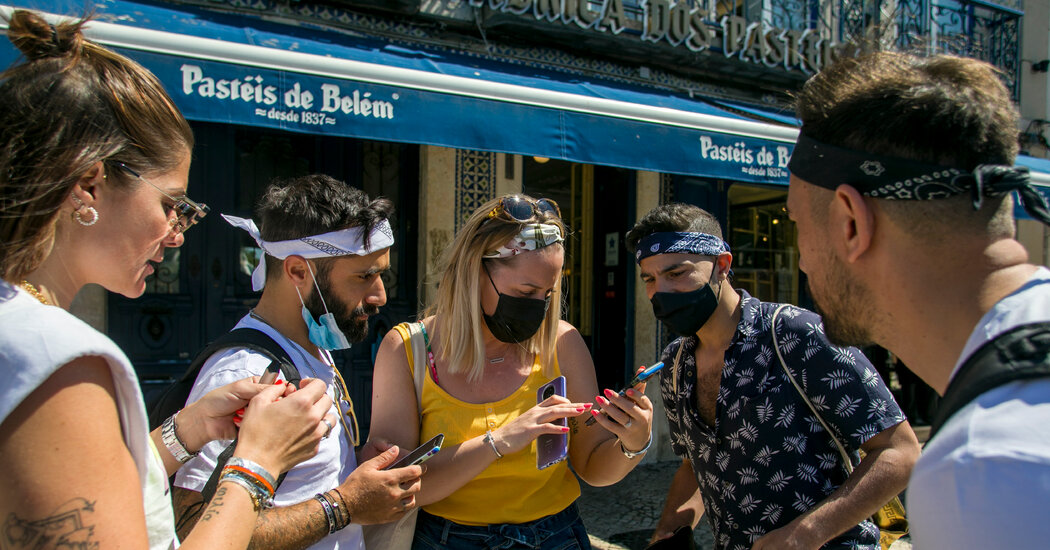 British Vacationers Return to Portugal, Unleashed however (Primarily) Masked